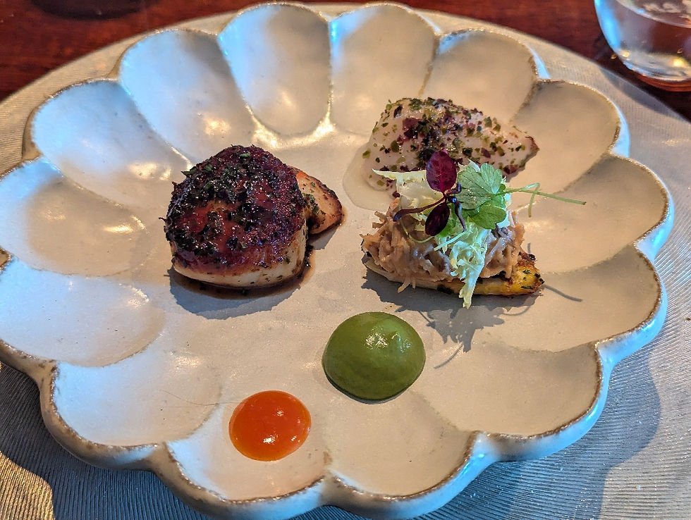 2 scallops,1 cooked the other cervice with crab topped asparagus