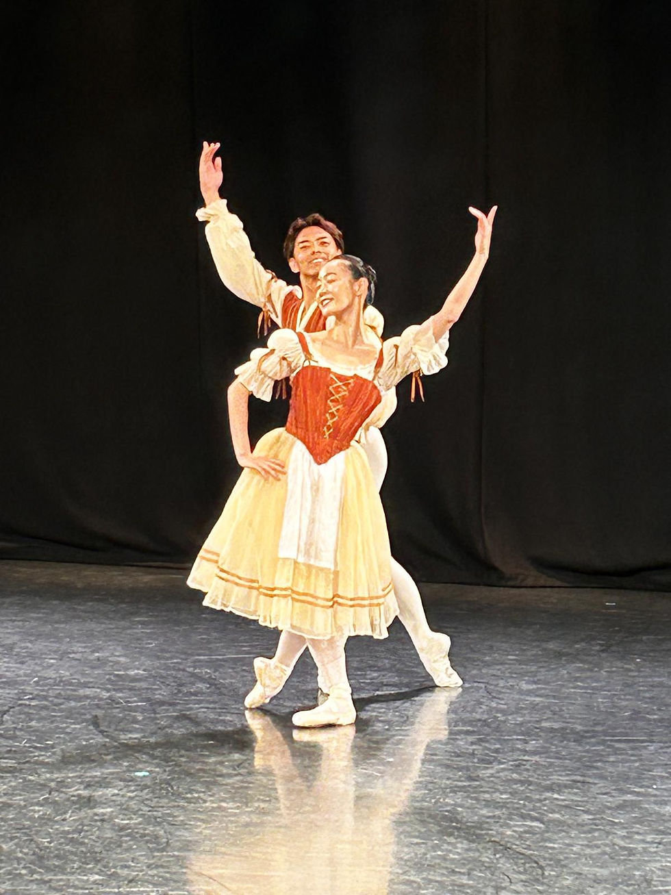 A male and female ballet dancer dance joyfully together
