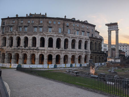 The exterior of the Colosseum in Rome at sunset