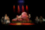 A chained dancer in front of Jabba the Hutt with other characters on-looking