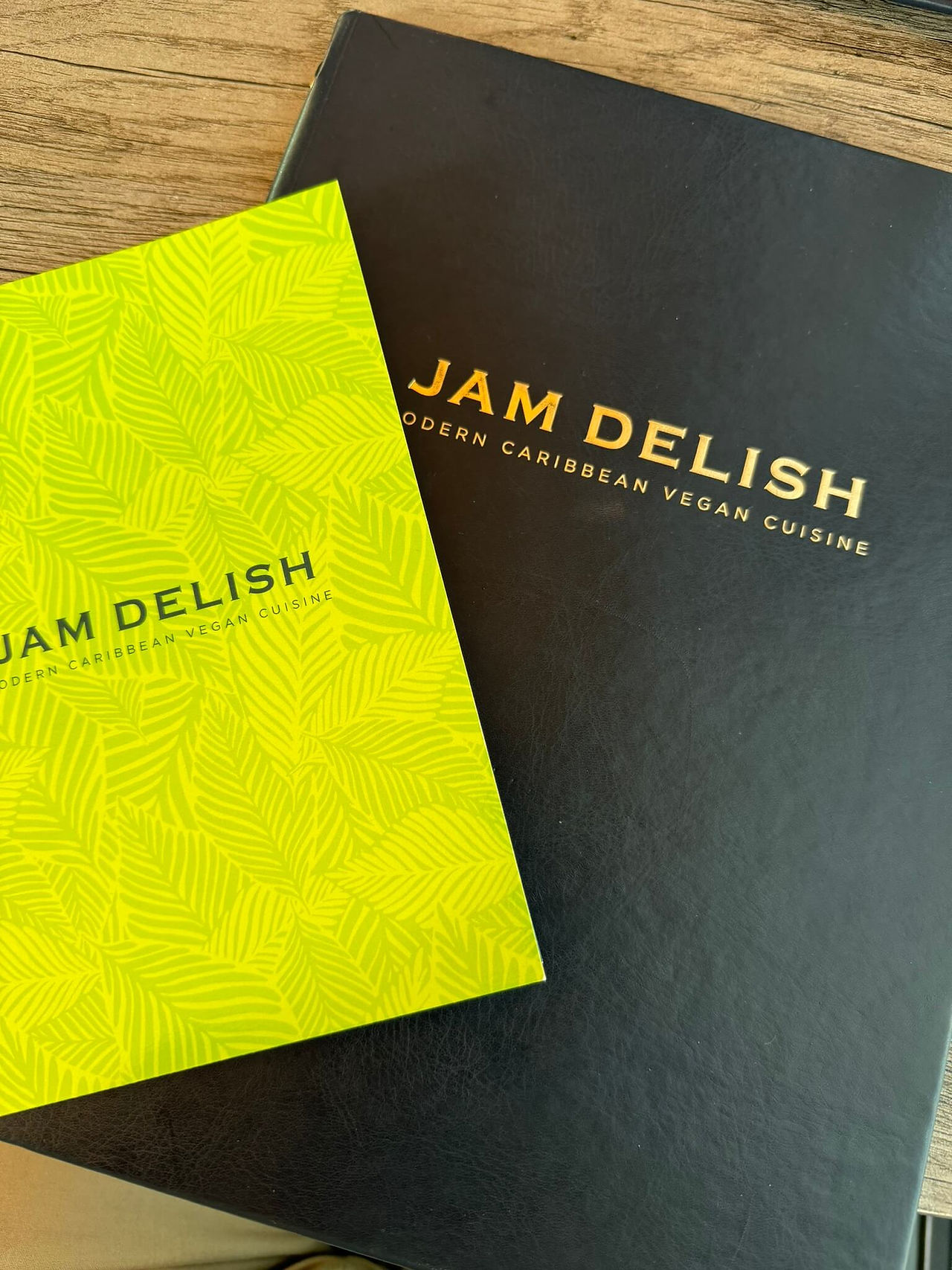 Image of Jam Delish drinks and food menu, green and black in colour, respectively.