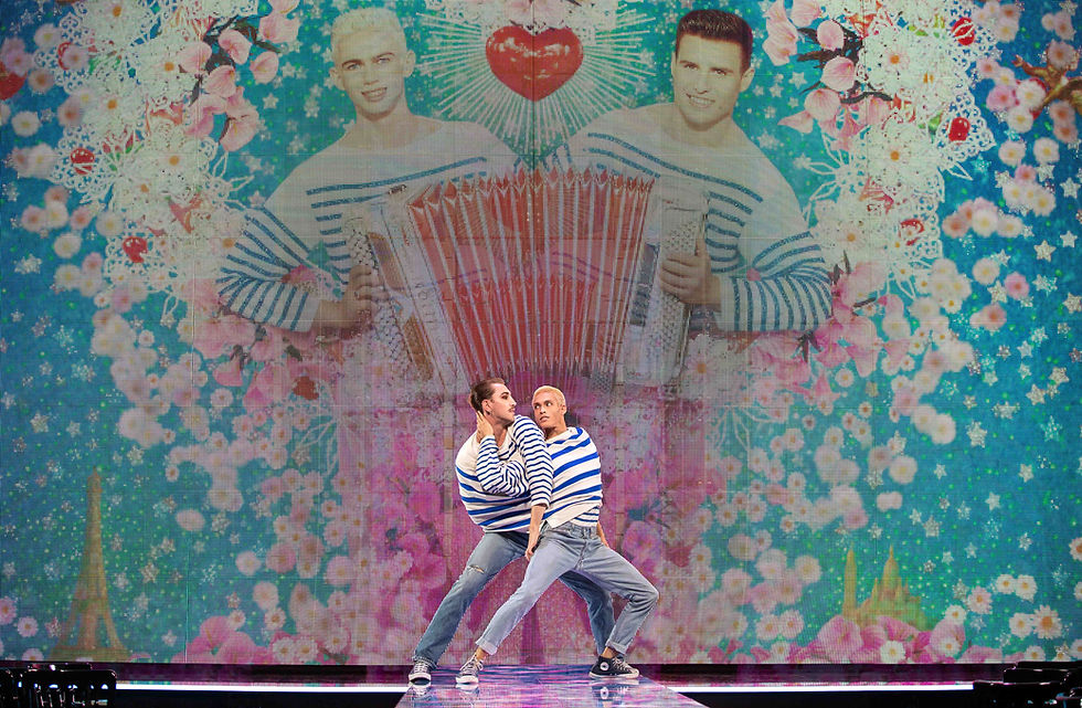 Duo dancing in a single jumper.