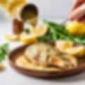 lemon pepper sauce being drizzled over chicken.jpg