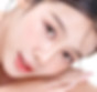 Young woman with glowing skin using K-beauty style skincare products
