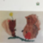 two hedgehogs together with flowers in their paws