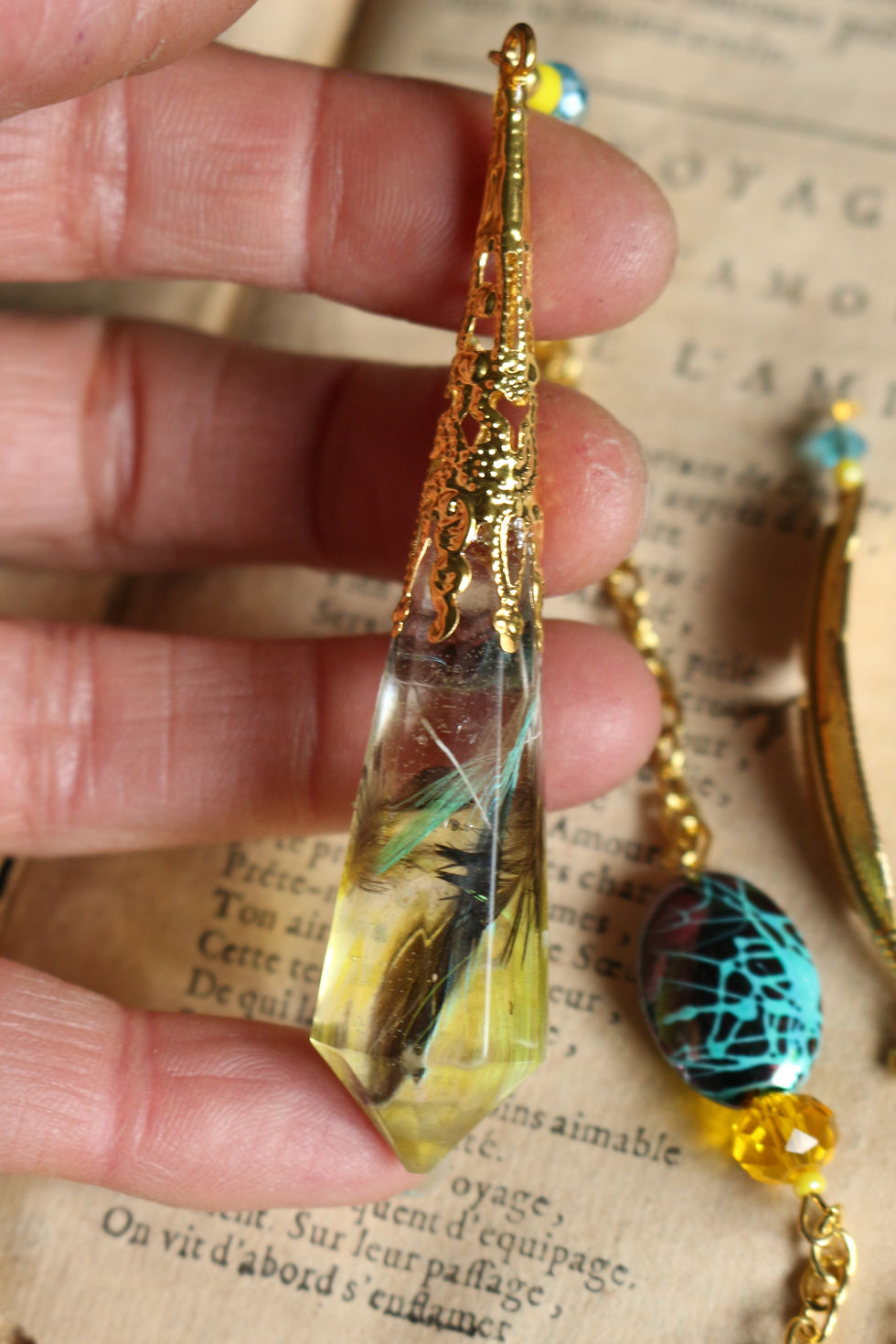Miniature : Pendule de plumes 