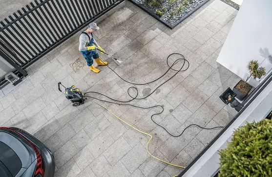 cleaning-garage-with-pressure-washer.webp