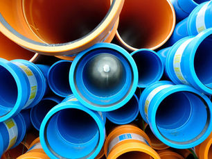 Underground pipes (blue and orange) showing black pipe seals