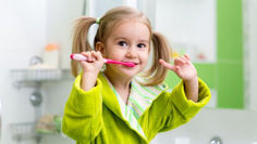Young child brushing teeth