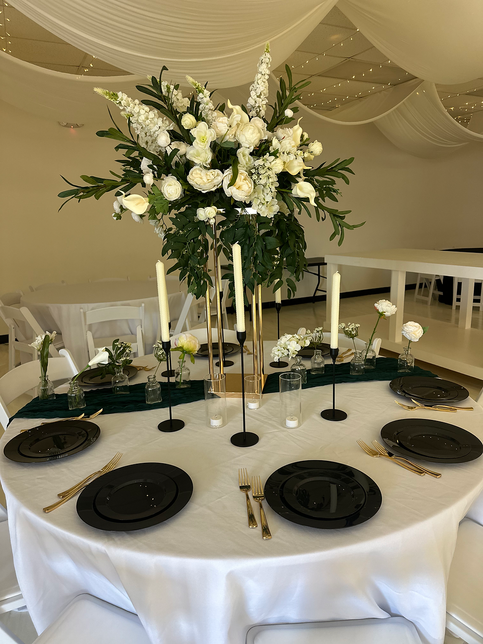 Elegant event table set with white flowers and tall candles