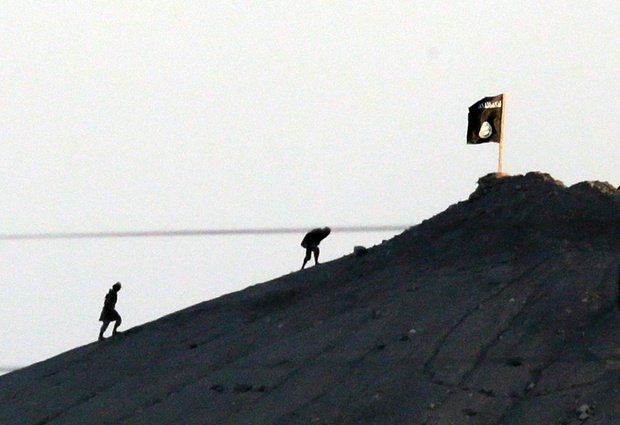 Shot with an extreme telephoto lens and through haze from the outskirts of Suruc
