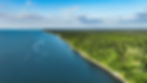 aerial-view-of-a-scenic-coastline-with-lush-green-2025-02-10-06-29-59-utc.jpg