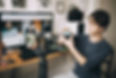 A business owner filming short-form video to build brand awareness across social media platforms.