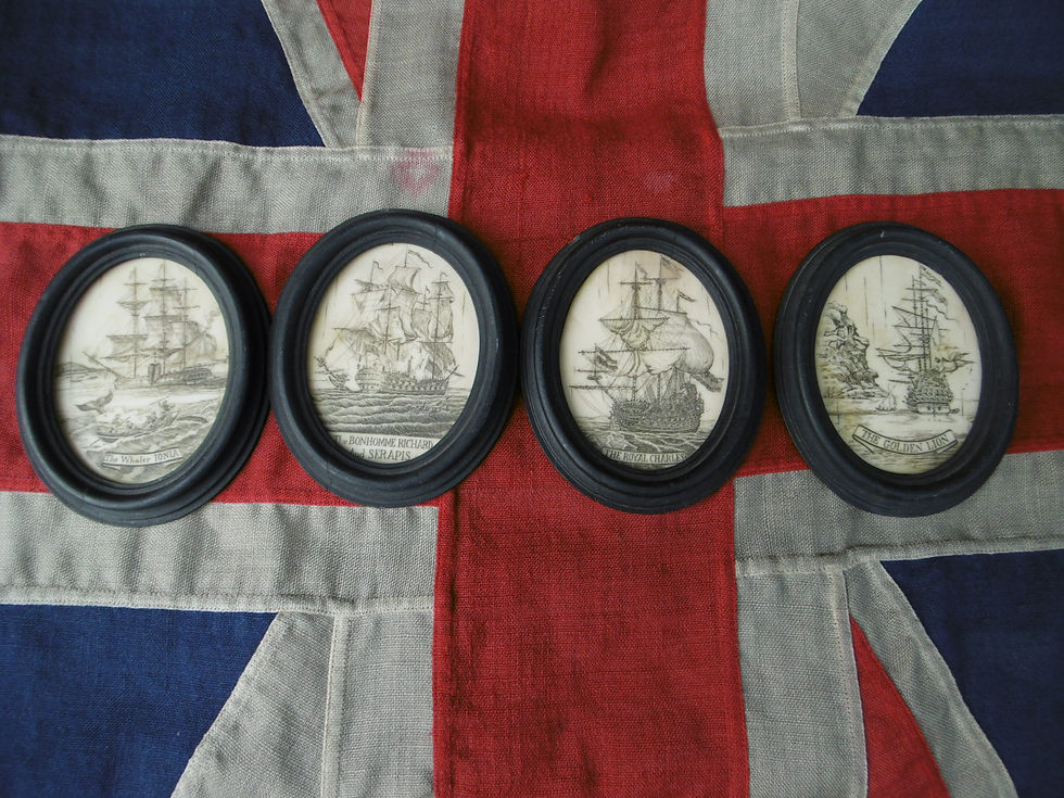 Four resin scrimshaw ovals