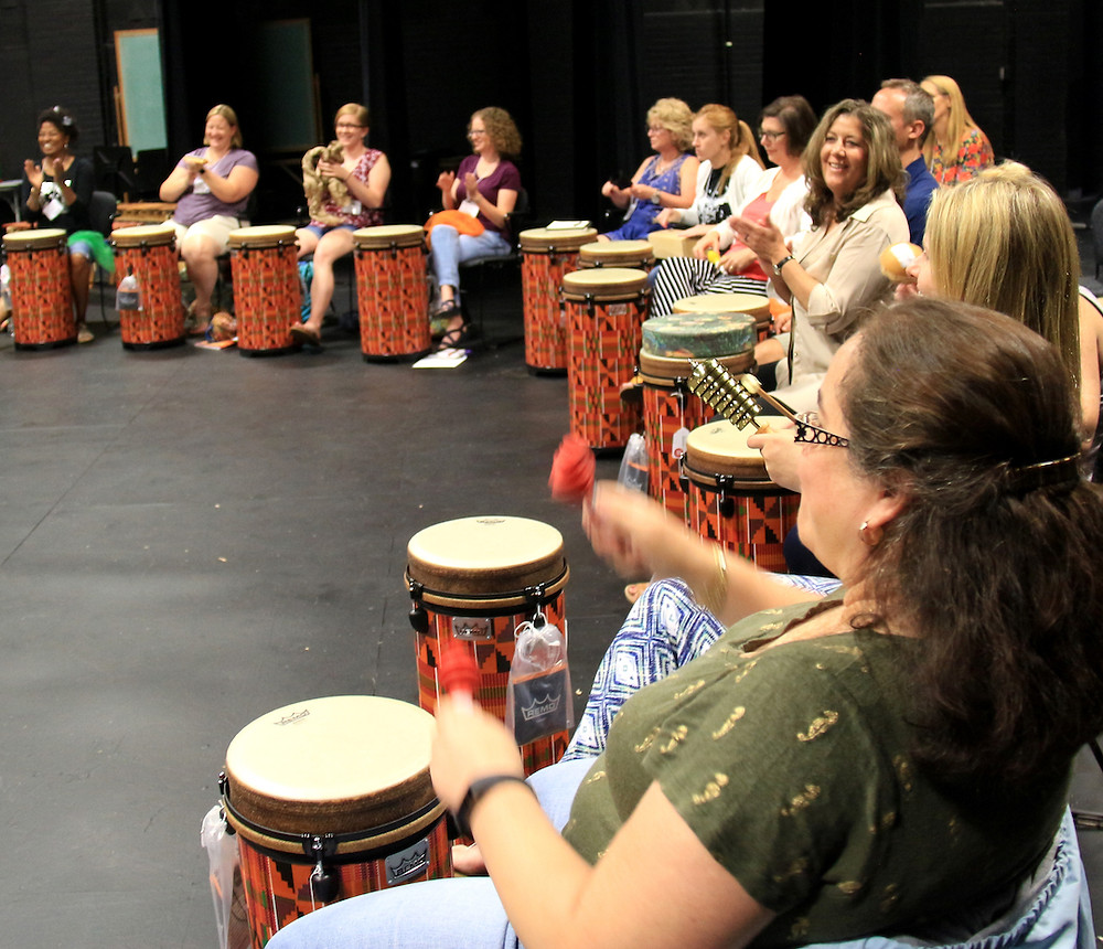 Participants engaged in World Music Drumming