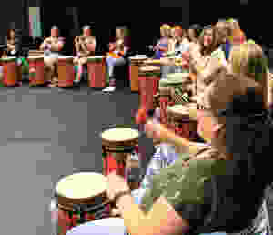 Participants engaged in World Music Drumming
