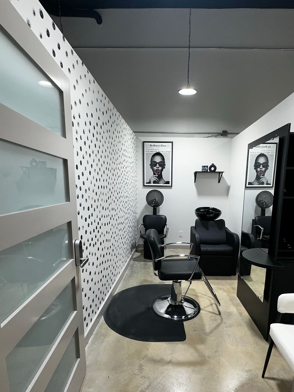 Eye-level view of a modern, private salon suite with stylish decor