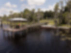 Elevated drone property media showcasing neighborhood waterfront amenities in Clermont