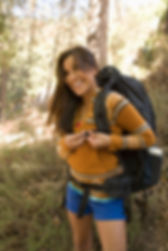 missouri girl laughing, buckling backpack, overnight camp trip, vacation hikers, hiking trails branson mo