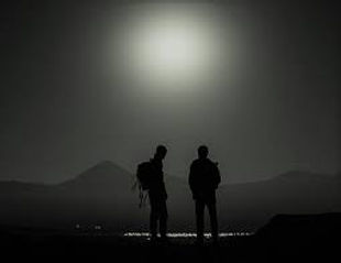 Men standing on the moonlight, hikig in Samos, Greece