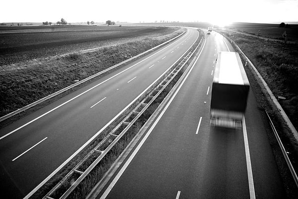 highway-traffic-motion-blurred-truck-on-a-highwa-2021-09-01-00-24-30-utc_edited.jpg