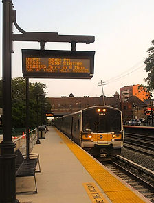 LIRR_train_passing_through_Kew_Gardens_station_edited.jpg