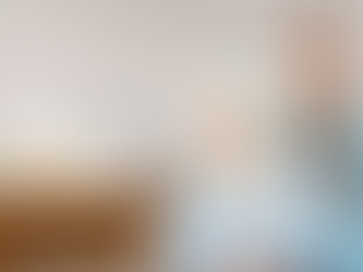 A healthcare professional with senior patient smiling