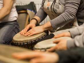 A woman playing the drums 