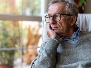 A man looking out a window