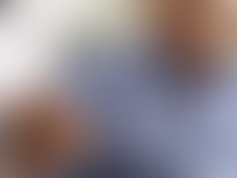 A caregiver and male patient holding hands