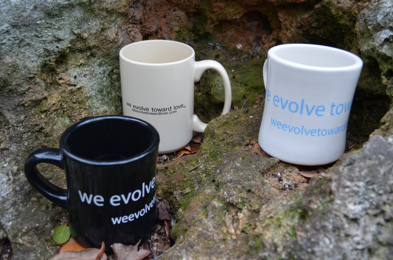 we evolve toward love® coffee mug pick one