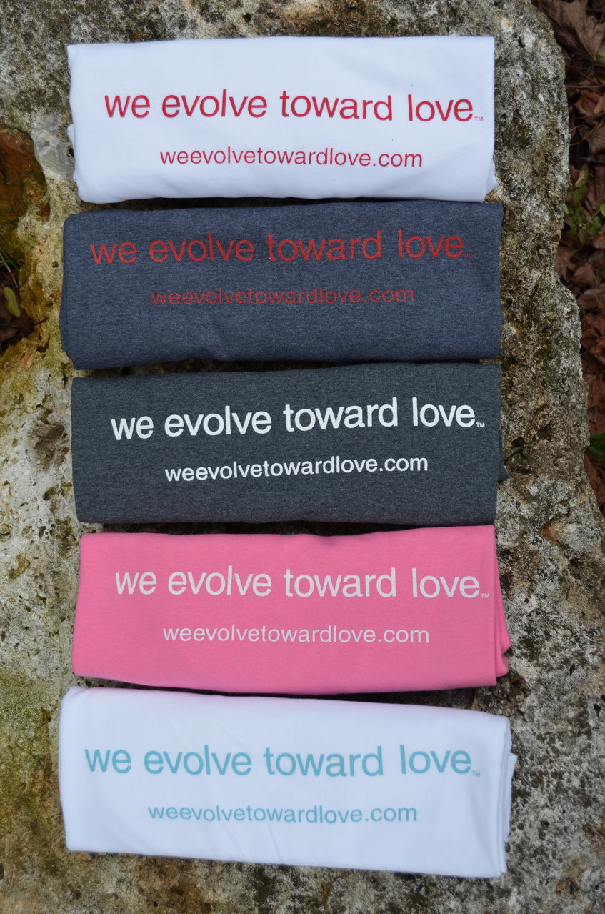 Thumbnail: we evolve toward love® assorted t-shirts pick one