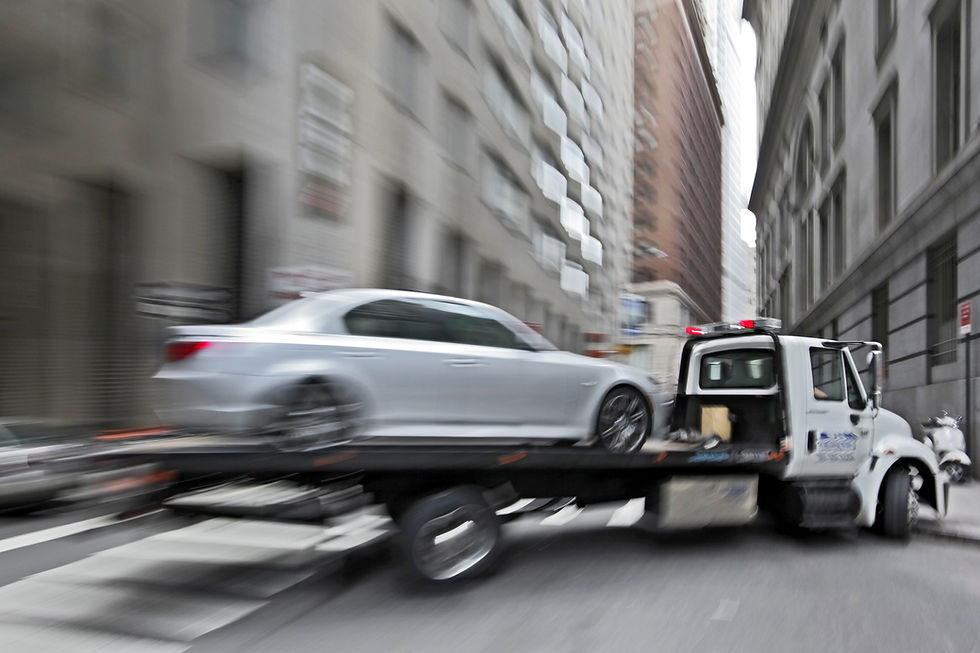 police department tow truck delivers the damaged vehicle.jpg