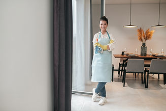 domestic-routine-smiling-housewife-apron-standing-kitchen (1).jpg