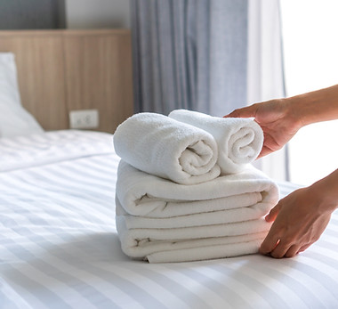 close-up-white-hotel-bed-sheets-towel-set-room-service-hotel-business-concept.jpg