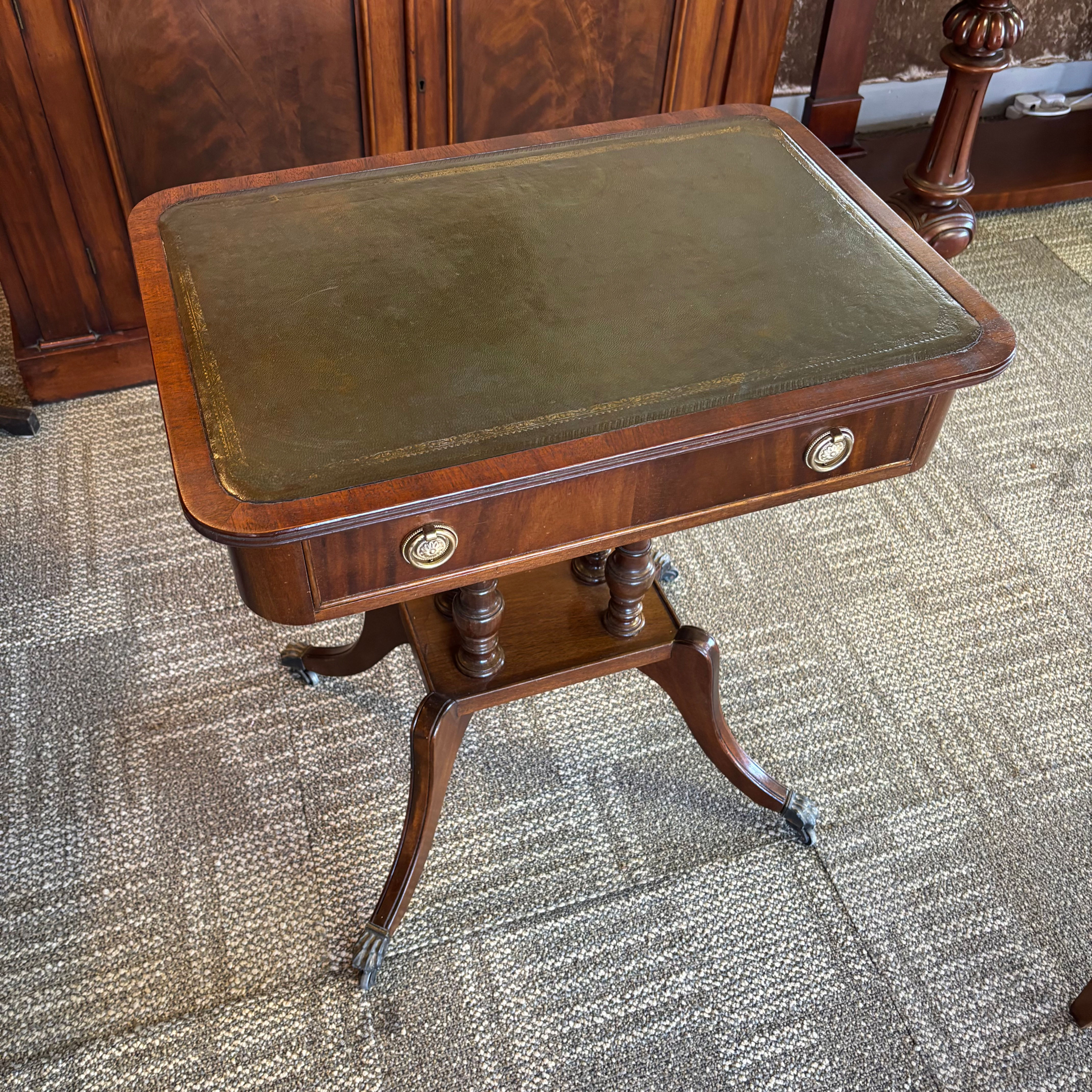 Mahogany occasional table with single drawer, sham drawer and green leather top