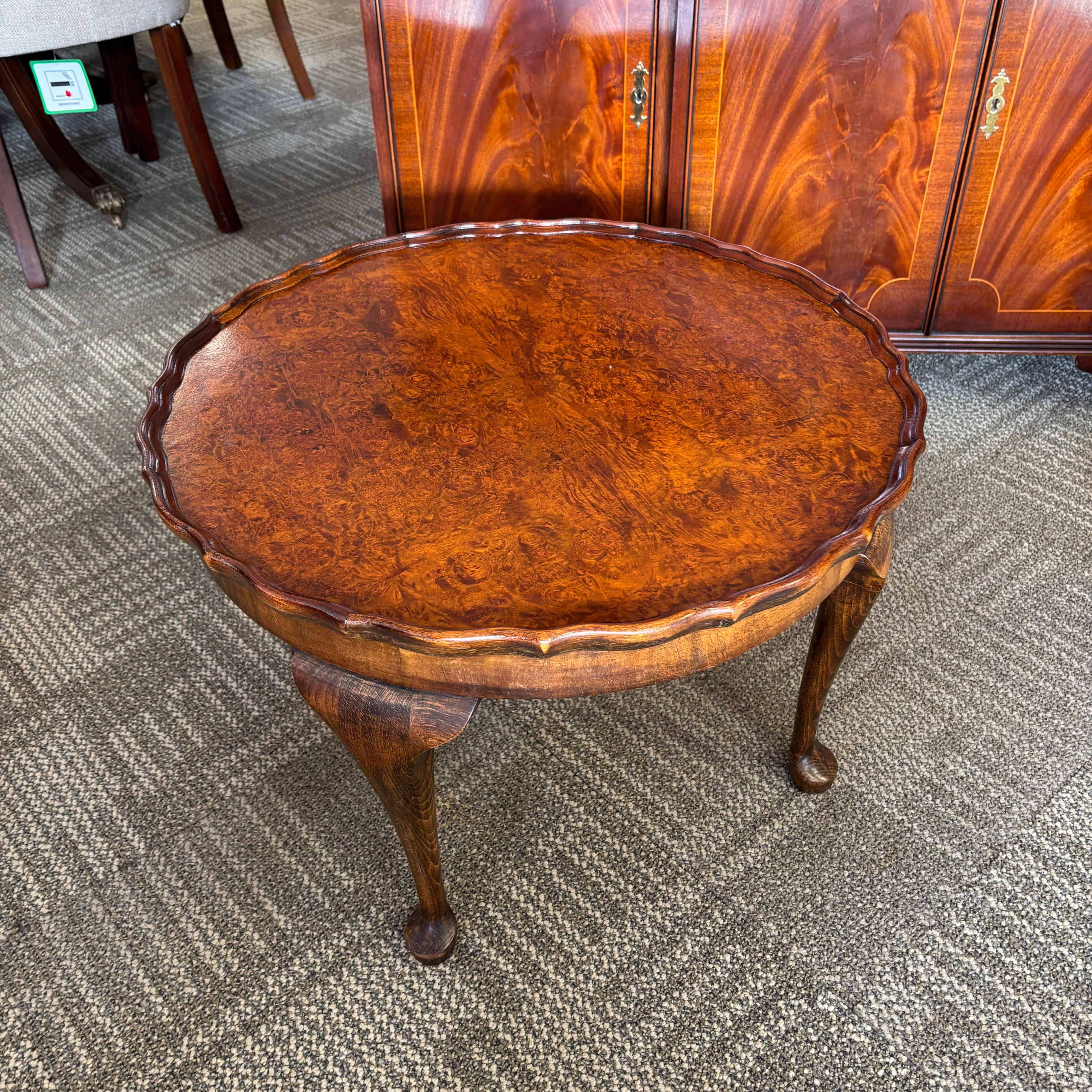 H. Shaw London walnut coffee table with shaped edge raised on cabriole legs