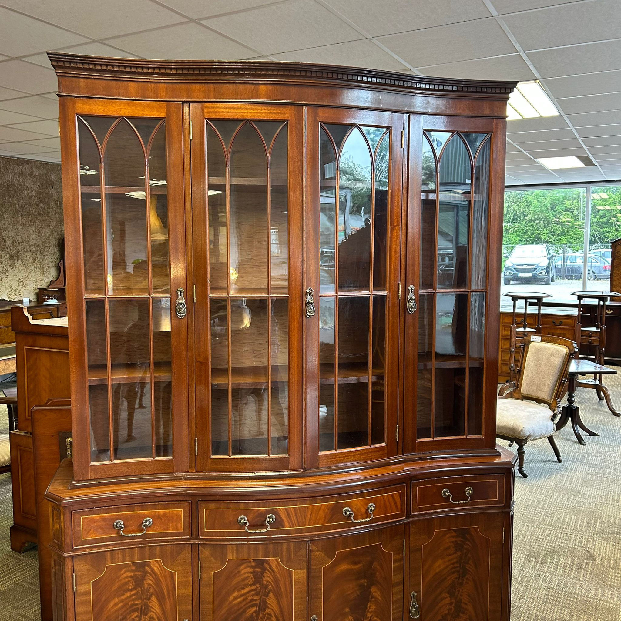 Mahogany flamed bow fronted four door display cabinet