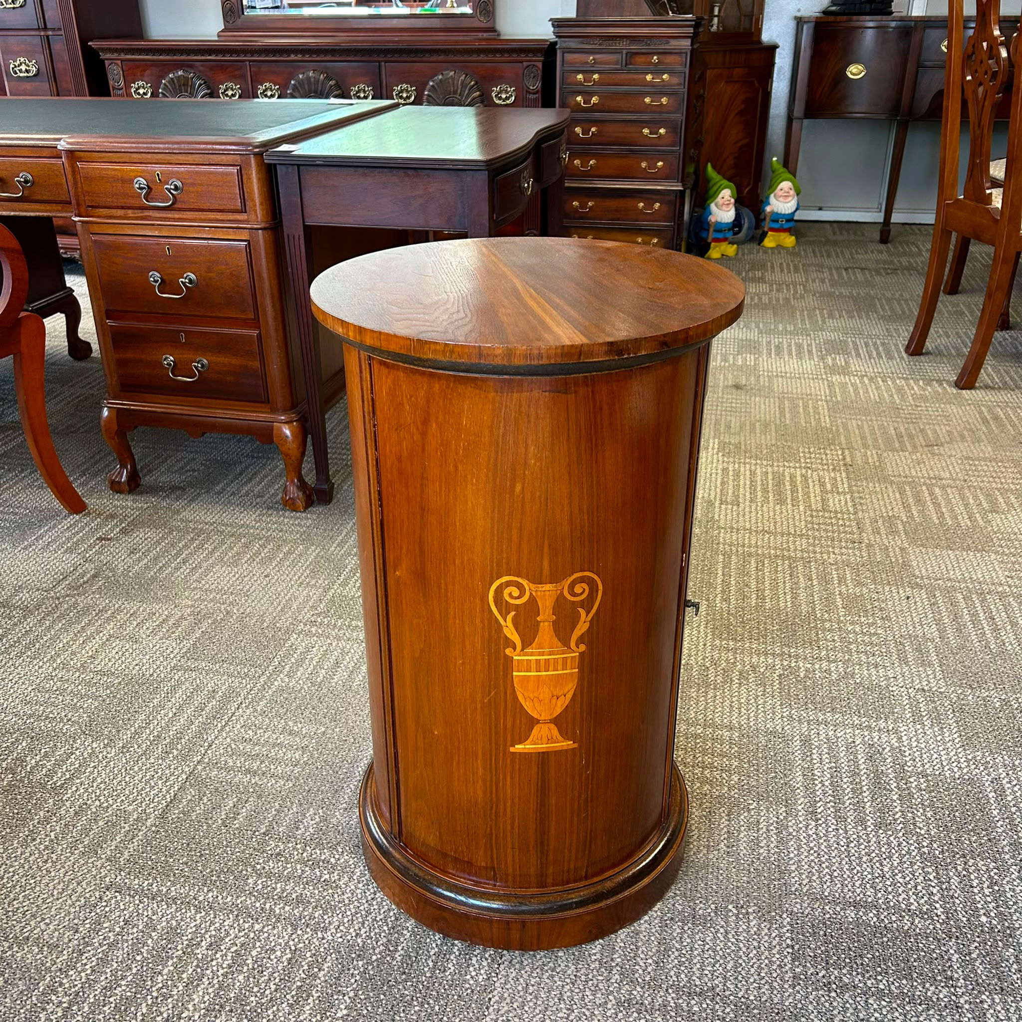 Edwardian mahogany cylinder cupboard featuring a beautifully figured top