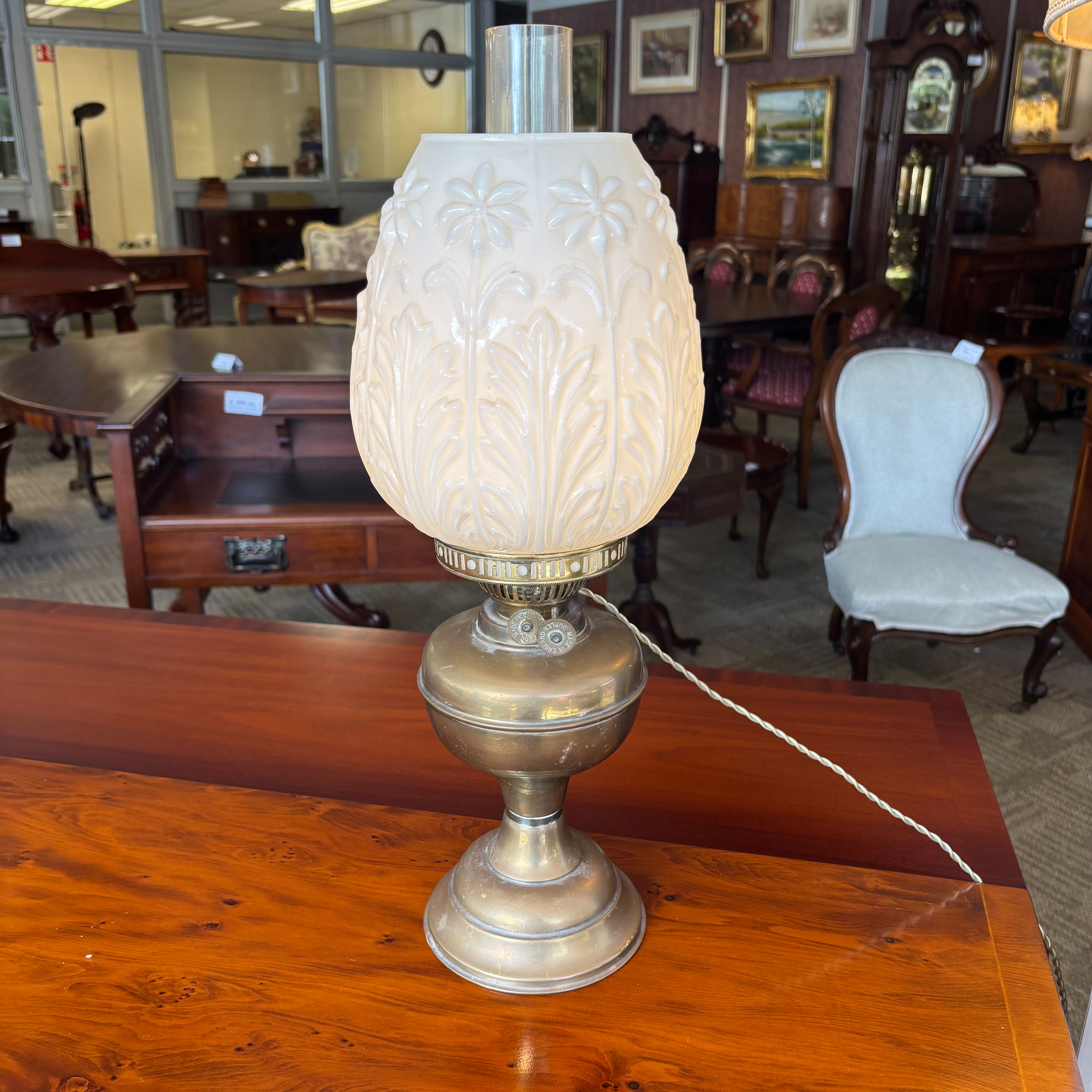 Brass base, embossed milk glass shade with a foliage pattern, antique table lamp