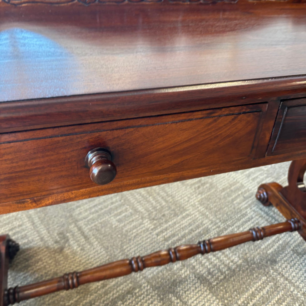 Thumbnail: Antique carved mahogany writing table with a scrolled stretcher