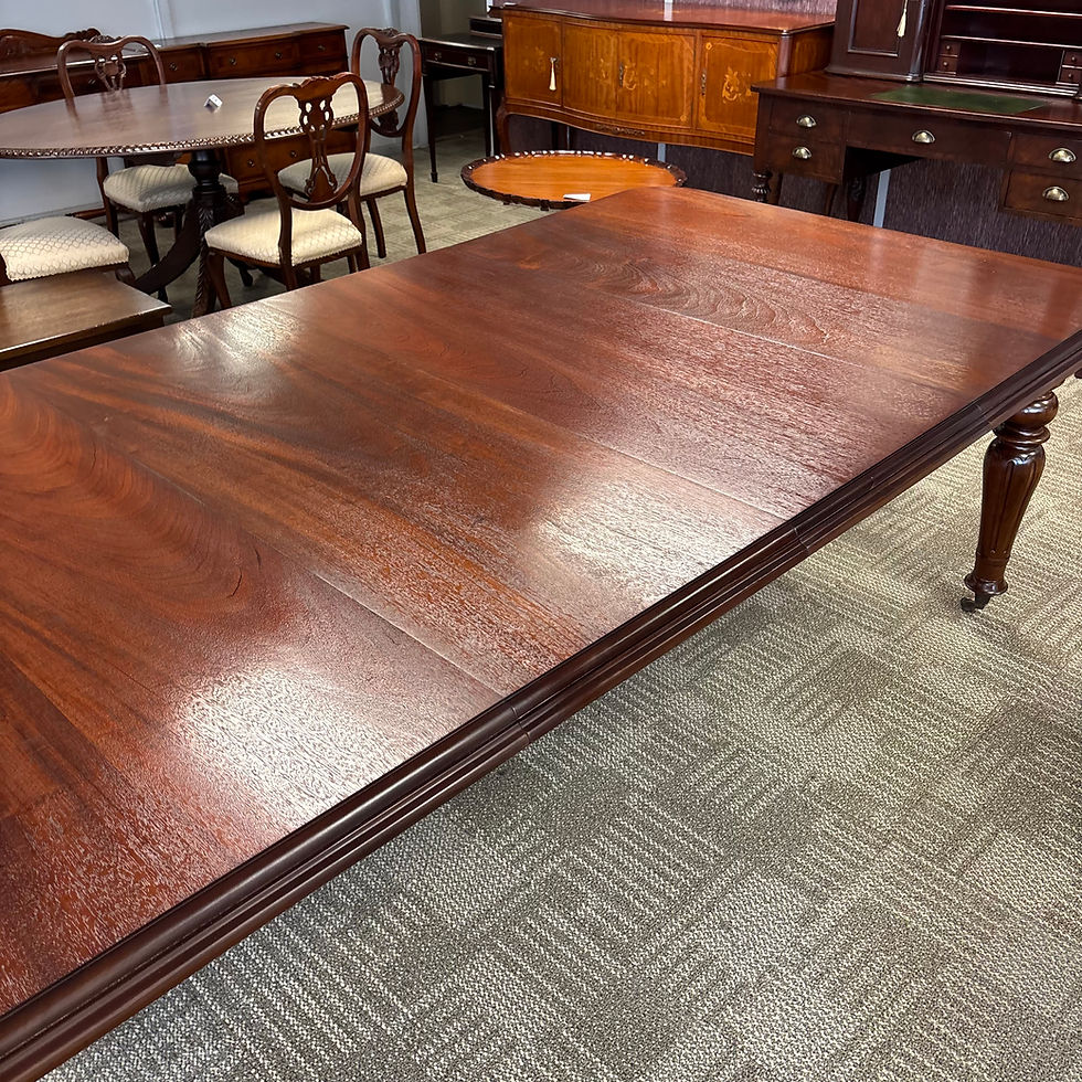 Thumbnail: Victorian-style mahogany extendable dining table with turned legs