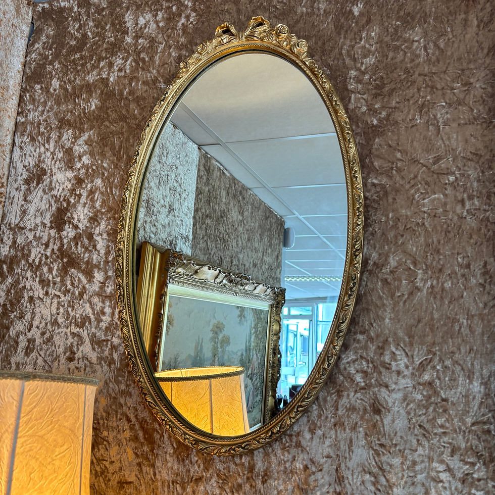 Beautiful ornate oval shaped bow on top wall mirror