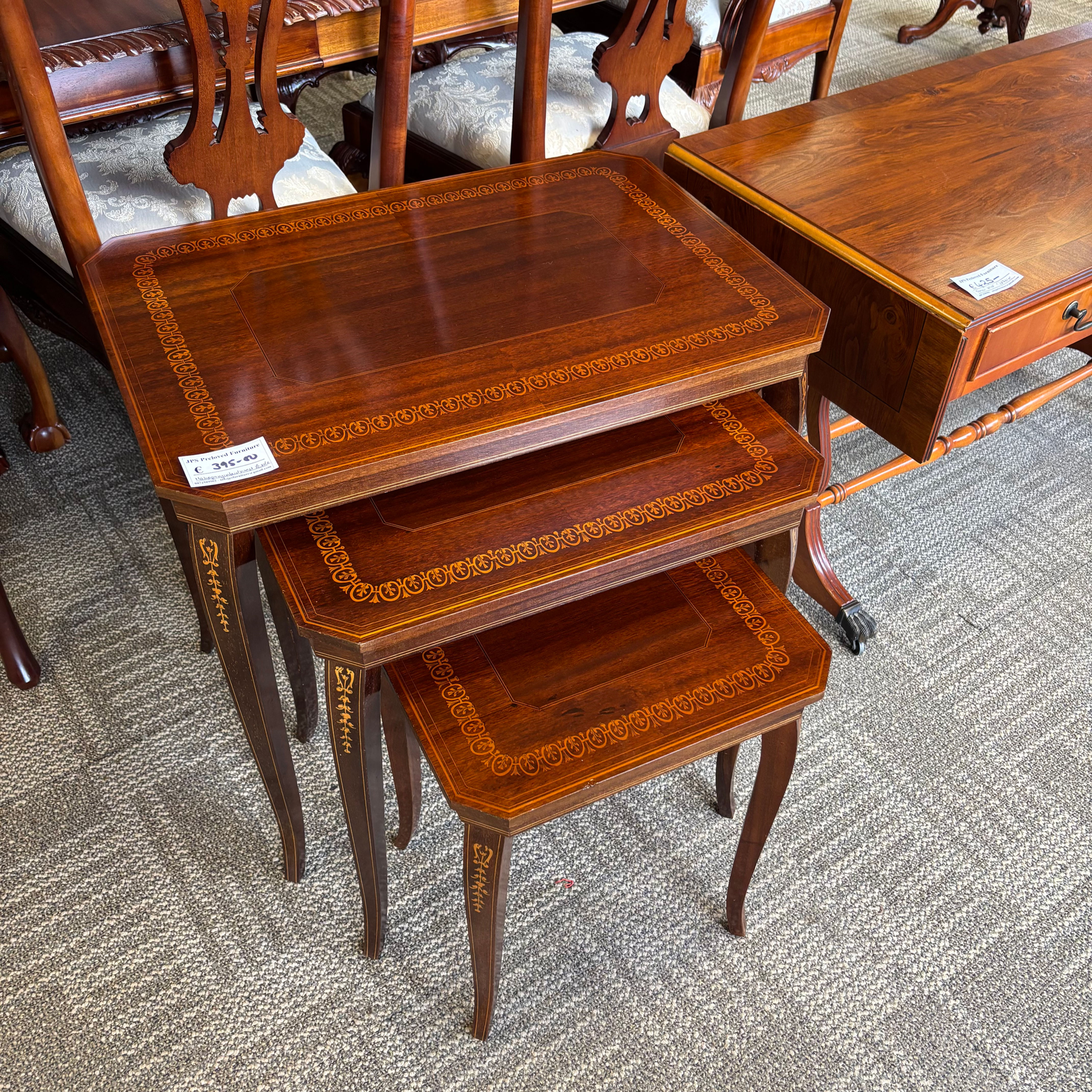 Set of three mahogany nest of tables features ornate inlay detailing