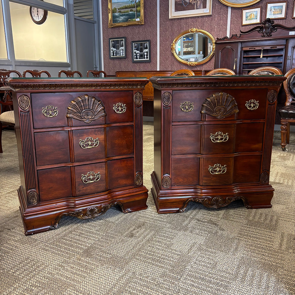 Thumbnail: A beautiful matching pair of traditional mahogany bedside chests with glass tops