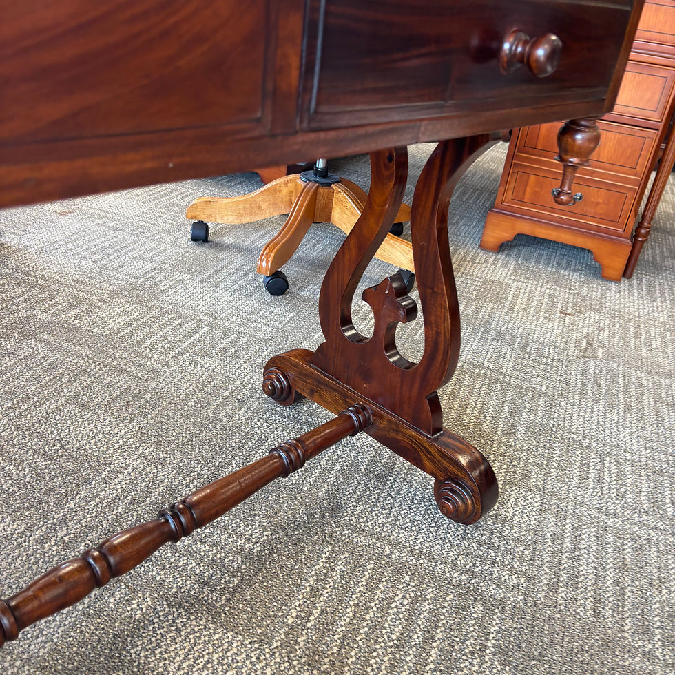 Thumbnail: Antique carved mahogany writing table with a scrolled stretcher