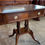 Thumbnail: Mahogany occasional table with single drawer, sham drawer and green leather top