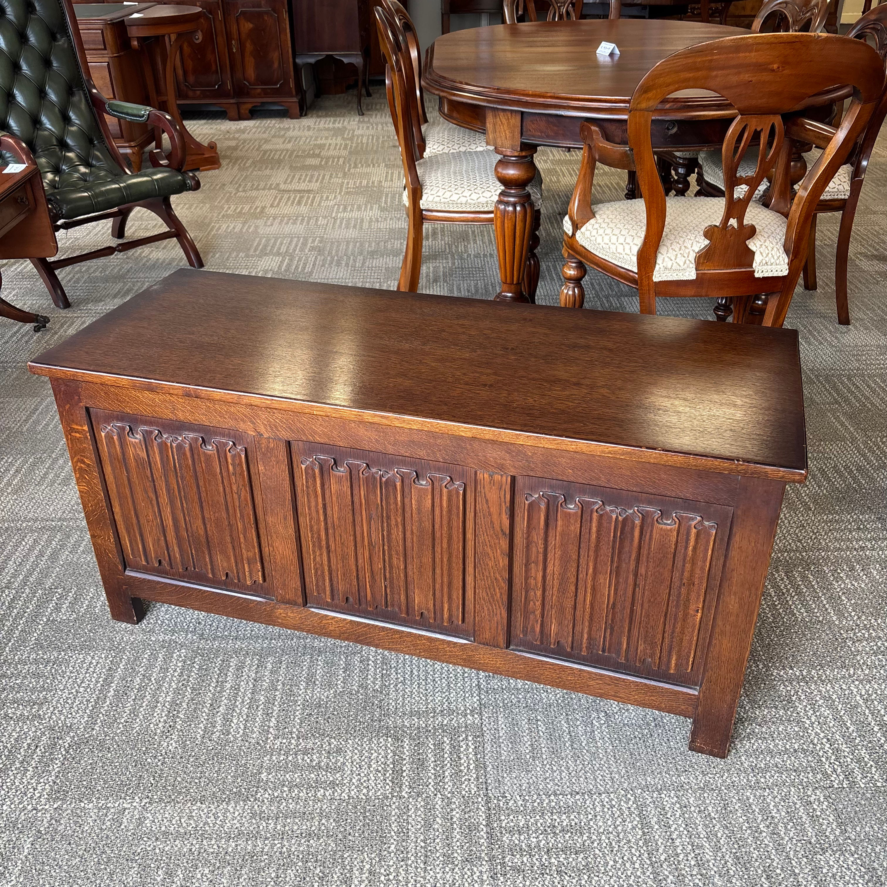 Oak carved linen fold blanket storage box, panels to front & lift up top