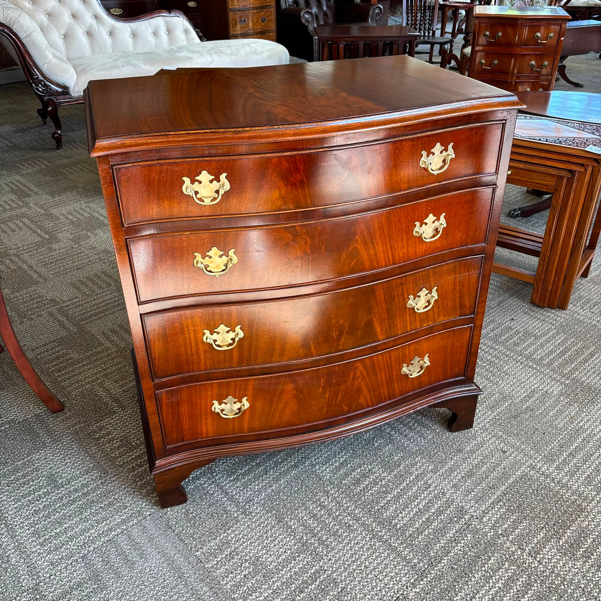 Vintage mahogany flamed serpentine chest of four drawers
