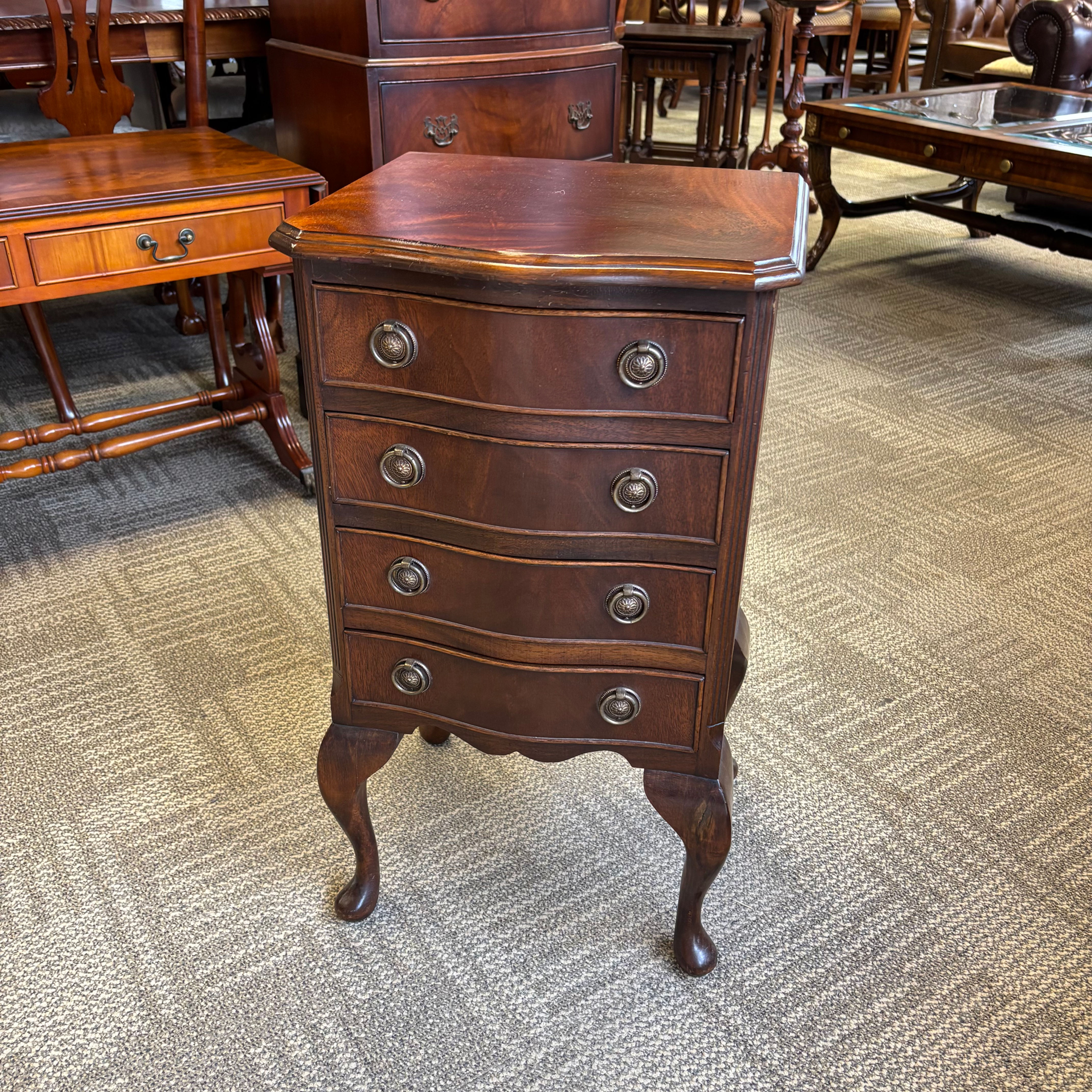 Mahogany chest of four drawers raised on cabriolet legs